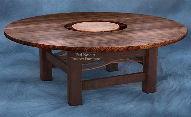 custom made round dining table showing solid zebrawood top with curly maple center